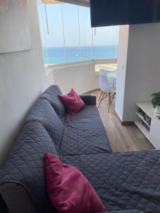 a bedroom with a bed and a view of the ocean at Mediterranean View Suite Costa del Sol in Fuengirola