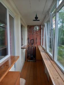 an empty room with a bench and windows at Dzintari in Jūrmala +1 photo