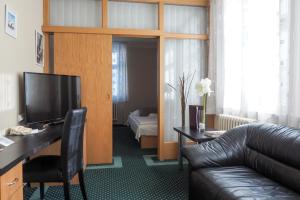 TV a/nebo společenská místnost v ubytování Hotel Vacek Pod Věží