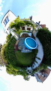 an aerial view of a house with a swimming pool at Calm, green & birdsong near the city center in Brussels