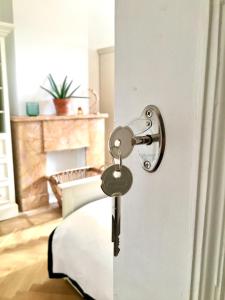 a key unlocking a door in a living room at Calm, green & birdsong near the city center in Brussels