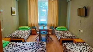 Postel nebo postele na pokoji v ubytování Happy Hostel
