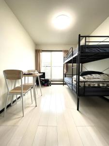 מיטה או מיטות קומותיים בחדר ב-Credo Maison Kamakura - Vacation STAY 10395