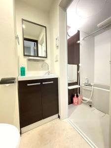 a bathroom with a sink and a mirror at Credo Maison Kamakura - Vacation STAY 10395 in Kamakura
