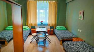 Postel nebo postele na pokoji v ubytování Happy Hostel