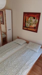 Postel nebo postele na pokoji v ubytování Apartman Ninolić