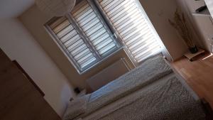 Postel nebo postele na pokoji v ubytování Apartman Ninolić