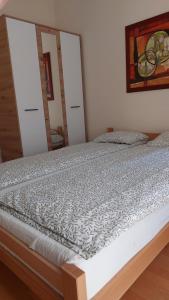 Postel nebo postele na pokoji v ubytování Apartman Ninolić