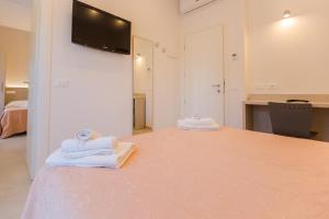 Postel nebo postele na pokoji v ubytování Hotel Altamarea