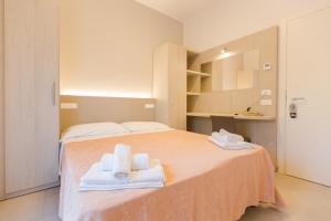 Postel nebo postele na pokoji v ubytování Hotel Altamarea