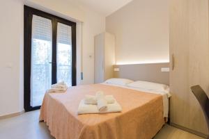 Postel nebo postele na pokoji v ubytování Hotel Altamarea
