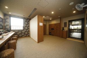 Kuchyň nebo kuchyňský kout v ubytování Dormy Inn Oita