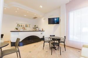 TV a/nebo společenská místnost v ubytování Hotel Altamarea