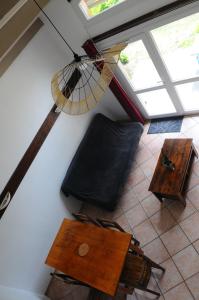 an overhead view of a room with a table and umbrella at Black Mountain Village in Cuxac-Cabardès