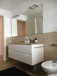 a bathroom with a sink and a mirror at See- & Bergblick Millstatt in Millstatt +22 photos