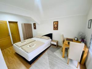 Postel nebo postele na pokoji v ubytování Unaqua Apartments