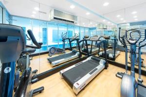 a gym with several treadmills and elliptical machines at Colley 11-11 Sub-Penthouse Luxurious Glenelg in Glenelg