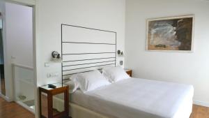 Un pat sau paturi într-o cameră la Las Villas de Cué