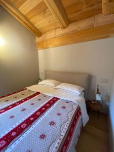Letto o letti in una camera di Alpi Azzurre