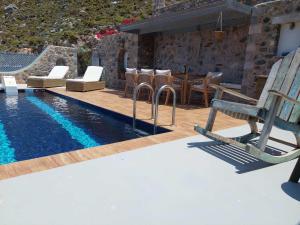 Bazén v ubytování Villa Kairos- Aegean Sea nebo v jeho okolí
