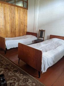 Postel nebo postele na pokoji v ubytování Tasia Guesthouse + 1 fotografie