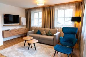 Televízia a/alebo spoločenská miestnosť v ubytovaní Bauernhofhotel "die Unterbergerin" - Zimmer mit Frühstück und Ferienwohnungen in Gastein mit GRATIS Thermeneintritt