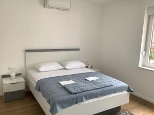 Postel nebo postele na pokoji v ubytování Apartments Jozef