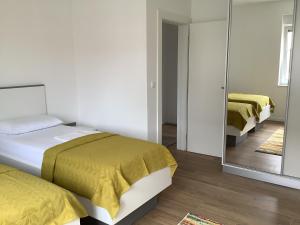 Postel nebo postele na pokoji v ubytování Apartments Jozef