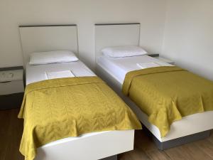 Postel nebo postele na pokoji v ubytování Apartments Jozef