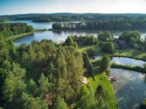 an aerial view of a lake with trees at Chata 'Leśne Kurki' in Kurki +6 photos