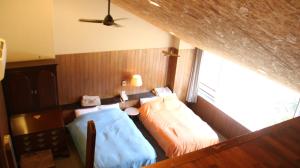 Postel nebo postele na pokoji v ubytování Sora no Mori Hotel Hanagori