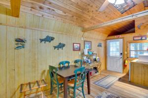 a dining room with a table and chairs at Emory Studio Cabin with Lake Fork Boat Access! in Emory
