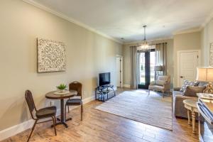 a living room with a couch and a tv at Swim, Golf and Bowl - Loretto Vacation Rental Apt! in Loretto