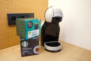 a coffee maker and a box on a counter at K&M Apartament Panorama in Bochnia