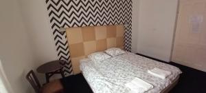 Posteľ alebo postele v izbe v ubytovaní Central Room