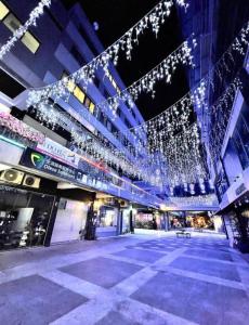 a large building with christmas lights hanging from it at 駐典Txg in Taichung