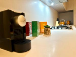 three books on a kitchen counter with a plant at Luxury 1 Bedroom Apartment in Adelaide CBD - 1 minute walk to Rundle mall - Free Wifi & Netflix in Adelaide +10 photos