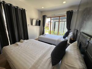 En eller flere senge i et værelse på Na Khonglong