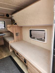 an interior view of an rv with a window at Muscat Caravans in Barka