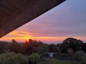 a sunset from under a bridge with the sky at Chalet en Quintueles afueras de Gijón Asturias in Quintueles