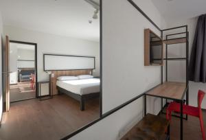 ibis Bulle - La Gruyère Swiss Bike Hotel客房内的一张或多张床位
