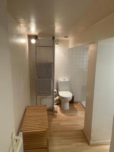 a small bathroom with a toilet and a sink at Maison Saint Jacques in Aubeterre-sur-Dronne