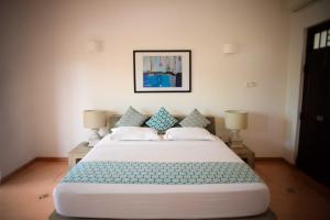 Кровать или кровати в номере Kingfisher