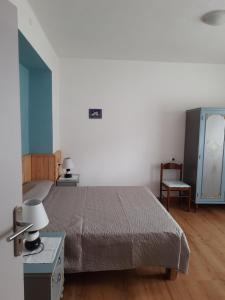 En eller flere senge i et værelse på Appartamento a 1000 metri