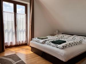 A bed or beds in a room at AnnApartman
