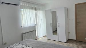 Postel nebo postele na pokoji v ubytování Apartment Andrea