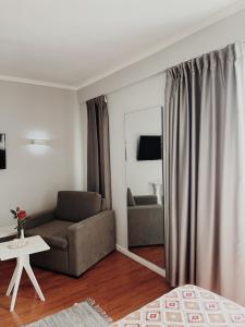 Televizorius ir (arba) pramogų centras apgyvendinimo įstaigoje Ruby Palace