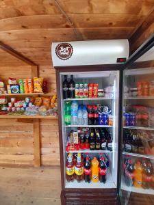 a refrigerator filled with lots of different types of drinks at Guesthouse of Irina in Chvabiani