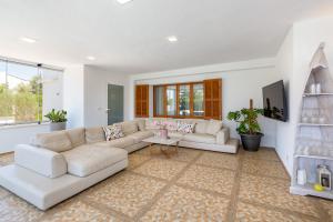 TV a/nebo společenská místnost v ubytování Ferienhaus Casa Kristel
