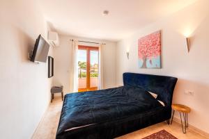 TV a/nebo společenská místnost v ubytování Ferienhaus Casa Kristel
